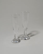 Closeup details of the Silje Lindrup Twisted Flute Glasses on light color background.