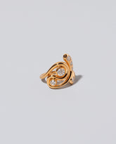 View from the side of the Twist It Ring on light color background.