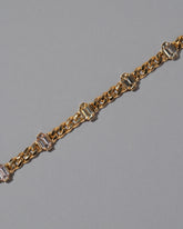 Closeup details of the Envelop Bracelet on grey color background.