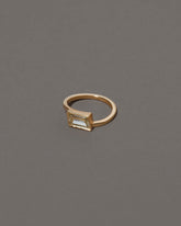 View from the side of the Jocundity Ring on grey color background.