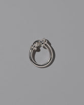 View from the side of the CRZM Sterling Silver Ridge Ring on light color background.