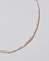 Stick Pearl Strand Necklace on light color background.