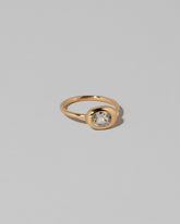 View from the side of the Oval Sapphire Equalize Ring on light color background.
