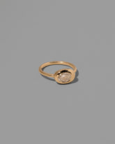 View from the side of the Oval Diamond Equalize Ring on light color background.