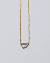 Closeup details of the Amplify Necklace on light color background.