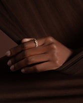 Styled image featuring the Gold Pavé Twist Band on model.
