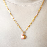 product_details::Hot Dog Chain Necklace, Dumpling Sauce Packet Charm and Steamed Dumpling Charm on model.