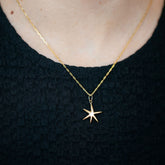 product_details::Hot Dog Chain Necklace and Gold Grand Verve Six Point Star Charm on model.