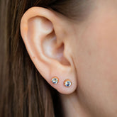 product_details::Bicolor Sapphire Sun & Moon Stud Earrings on model.