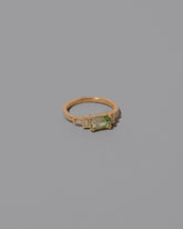 View from the side Bicolor Garnet Expression Ring on light color background.