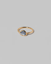 View from the side of the Gusher Blue Sapphire Ring 023 on light color background.