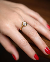 A past edition of the Diamond Poise Ring on model.