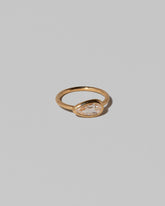 View from the side of the Gusher Diamond Ring 014 on light color background.