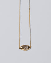 Closeup details of the State Shifter Necklace on light color background.