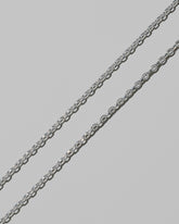 Closeup details of the CRZM 3.2mm Sterling Silver Short Loop Chain Necklace on light color background.