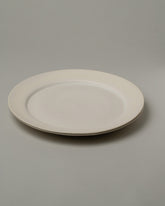 Tracie Hervy Dinner Plates Set on light color background.