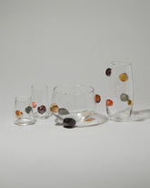 Jess Humphrey Studio Oblique Rocks Vase, Rocks Bowl, Rocks Vase, Petite Rocks Glass and Rocks Glass on light color background.