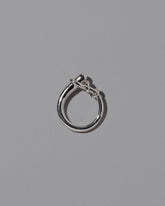 View from the side of the CRZM Sterling Silver Terrane Ring on light color background.