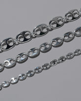 Closeup details of the CRZM Sterling Silver Yuba Mini Bracelet, Sterling Silver Yuba Medium Bracelet, and Sterling Silver Yuba Bracelet on light color background.