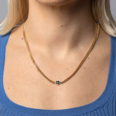 product_details::Emerald Fold Necklace on model.