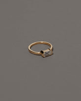 View from the side of the Conviviality Ring on grey color background.
