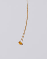 Venus Heart Pendant on light color background.