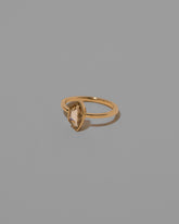 View from the side of the Adulation Ring on light color background.