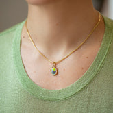 product_details::Harmony Pendant paired with 2mm Ritual Chain Necklace on model.