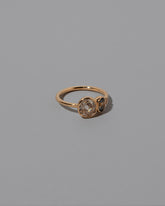 View from the side of the Luxuriance Ring on light color background.