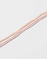 Multi Strand Seed Pearl Choker on light color background.