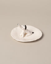Closeup detail of the Eleonor Boström Dog Ring Dish on light color background.