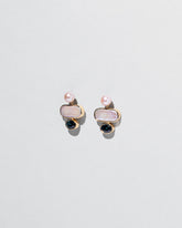 Mantle Earrings on light color background.