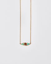 Sunstone & Turquoise Eye Necklace on light color background.