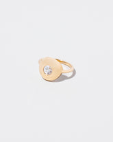 Petite Exposition Ring on light color background.