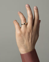 Gold with Six Stone Black Diamond 1.6mm 4mm Square Wire Band on male model.