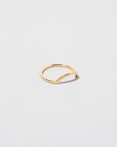 View from the side of the Gold Square Wire Curve Band on light color background.