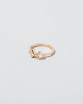 Rise & Fall Ring on light color background.