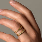 product_details::Gold Infinity Etched Bands on male model.