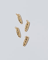 Demi Baguette Charms on light color background.