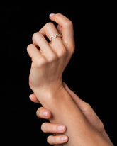 Styled image featuring the Gold White Diamond Low Tide Band on model.