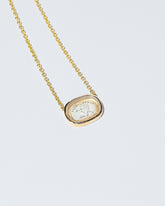 Arrow Intaglio Necklace on light color background.