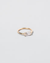 Elixer Ring on light color background.