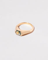 View from the side of the Caelum Ring on light color background.