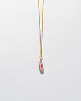 Rhodolite Drop Pendant on light color background.