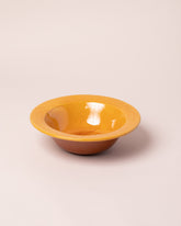 La Ceramica Vincenzo Del Monaco Caramel Yellow First Course Bowl on light color background.