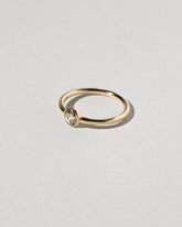 View from the side of the Rose Cut Champagne Diamond Ring on light color background.