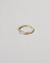 View from the side of the Bullet Cut Diamond Ring on light color background.