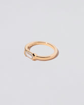 View from the side of the Alcon Ring on light color background.