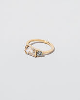 Pursuit Ring on light color background.