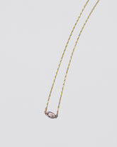 Sweet Heart Necklace on light color background.